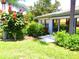 Private patio area with tropical landscaping at 2501 Lonigan Pl, Sun City Center, FL 33573