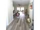 Bright living room with hardwood flooring and access to a patio at 2501 Lonigan Pl, Sun City Center, FL 33573