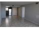 Bright living room with tile floors and kitchen access at 6009 Sea Ranch Dr # 705, Hudson, FL 34667