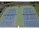 Two well-maintained tennis courts at 6009 Sea Ranch Dr # 705, Hudson, FL 34667
