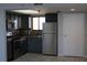 Modern kitchen with stainless steel appliances and gray cabinets at 6009 Sea Ranch Dr # 705, Hudson, FL 34667