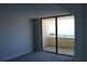 Bedroom with sliding glass doors leading to balcony and stunning ocean view at 6009 Sea Ranch Dr # 705, Hudson, FL 34667