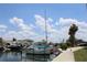 Sailboat in a marina with other boats and waterfront homes at 6009 Sea Ranch Dr # 705, Hudson, FL 34667