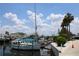 Sailboat in a marina with other boats and waterfront homes at 6009 Sea Ranch Dr # 705, Hudson, FL 34667