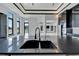 Sleek kitchen island with a modern double sink and faucet at 517 Treviso Dr, Apollo Beach, FL 33572