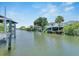 Waterfront property with private boat docks and lush canal-side vegetation at 517 Treviso Dr, Apollo Beach, FL 33572