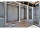 Large walk-in closet with custom built-ins and LED lighting at 517 Treviso Dr, Apollo Beach, FL 33572