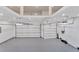 Spacious two-car garage with high ceilings and epoxy flooring at 517 Treviso Dr, Apollo Beach, FL 33572
