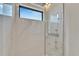 Modern shower with marble tile and a rainfall shower head at 517 Treviso Dr, Apollo Beach, FL 33572