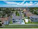 Aerial view of waterfront home with pool and private dock, located near Tampa Bay at 517 Treviso Dr, Apollo Beach, FL 33572