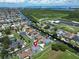 Aerial view of property highlighting its waterfront location and neighborhood at 517 Treviso Dr, Apollo Beach, FL 33572