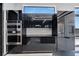 Modern kitchen with stainless steel appliances and black cabinetry at 517 Treviso Dr, Apollo Beach, FL 33572