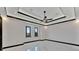 Spacious bedroom featuring marble floors and a ceiling fan at 517 Treviso Dr, Apollo Beach, FL 33572