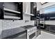 Modern kitchen with stainless steel appliances and white cabinetry at 517 Treviso Dr, Apollo Beach, FL 33572