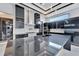 Luxury kitchen features dark cabinetry, quartz countertops, and high-end appliances at 517 Treviso Dr, Apollo Beach, FL 33572