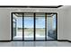 Spacious back patio accessible through sliding glass doors at 517 Treviso Dr, Apollo Beach, FL 33572