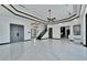 Spacious living room with marble floors and access to kitchen and stairs at 517 Treviso Dr, Apollo Beach, FL 33572