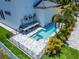 Elevated view of the pool and spa area with a fence at 517 Treviso Dr, Apollo Beach, FL 33572