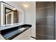 Modern bathroom with a large mirror and sleek vanity at 517 Treviso Dr, Apollo Beach, FL 33572