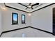 Bright bedroom with marble floors and large windows at 517 Treviso Dr, Apollo Beach, FL 33572