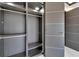 Large walk-in closet with ample shelving and hanging space at 517 Treviso Dr, Apollo Beach, FL 33572