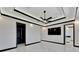 Modern bedroom with marble floors, large TV, and ample closet space at 517 Treviso Dr, Apollo Beach, FL 33572
