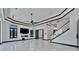 Bright living room features a fireplace, marble floors, and modern lighting at 517 Treviso Dr, Apollo Beach, FL 33572