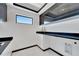Bright laundry room with modern cabinetry and quartz countertops at 517 Treviso Dr, Apollo Beach, FL 33572
