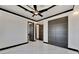 Modern bedroom with marble floors and dark wood doors at 517 Treviso Dr, Apollo Beach, FL 33572