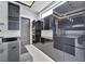 Modern kitchen with black cabinets and stainless steel appliances at 517 Treviso Dr, Apollo Beach, FL 33572