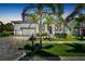 Two story house with a large driveway and landscaping at 517 Treviso Dr, Apollo Beach, FL 33572