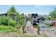 Private wooden dock with access to the waterway, featuring a covered boat lift at 517 Treviso Dr, Apollo Beach, FL 33572