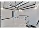 Modern hallway with marble floors and glass railing at 517 Treviso Dr, Apollo Beach, FL 33572