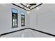 Bright bedroom with marble floors, ceiling fan and large windows at 517 Treviso Dr, Apollo Beach, FL 33572