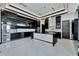 High-end kitchen boasts black cabinets, quartz countertops, and stainless steel appliances at 517 Treviso Dr, Apollo Beach, FL 33572