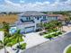 Aerial view of two-story home with pool and driveway at 517 Treviso Dr, Apollo Beach, FL 33572