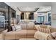 Open floor plan, featuring a large sectional sofa and modern kitchen at 519 Treviso Dr, Apollo Beach, FL 33572
