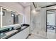 Modern bathroom with double vanity and glass shower at 519 Treviso Dr, Apollo Beach, FL 33572