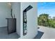 Modern outdoor shower with multiple spray settings and a side table at 519 Treviso Dr, Apollo Beach, FL 33572