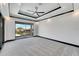 Bright bedroom with balcony access and water views at 519 Treviso Dr, Apollo Beach, FL 33572
