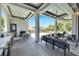 Relaxing outdoor lounge with sectional sofa and fire pit at 519 Treviso Dr, Apollo Beach, FL 33572