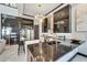 Modern kitchen with dark cabinetry, quartz countertops, and high-end appliances at 519 Treviso Dr, Apollo Beach, FL 33572