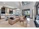 Open concept living area with modern kitchen and fireplace at 519 Treviso Dr, Apollo Beach, FL 33572