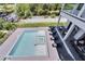 Elevated view of a pristine pool and spa with lounge chairs at 519 Treviso Dr, Apollo Beach, FL 33572