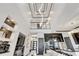 Two-story living room with high ceilings, modern kitchen, and open floor plan at 519 Treviso Dr, Apollo Beach, FL 33572