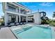 Modern, elevated pool and spa with expansive patio; resort style at 519 Treviso Dr, Apollo Beach, FL 33572