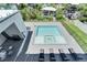 Elevated view of a pristine pool with jacuzzi, lounge chairs, and a patio area at 519 Treviso Dr, Apollo Beach, FL 33572