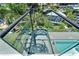 Modern glass spiral staircase leading down to the pool area at 519 Treviso Dr, Apollo Beach, FL 33572