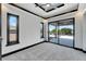 Bright bedroom with balcony access and plush carpeting at 519 Treviso Dr, Apollo Beach, FL 33572