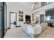 Spacious living room with sectional sofa, fireplace and access to an office at 519 Treviso Dr, Apollo Beach, FL 33572